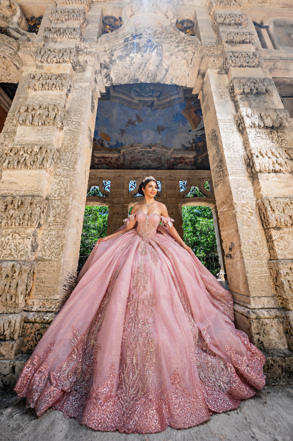 Model wearing a sparkling pink Aqua Luna quinceañera gown